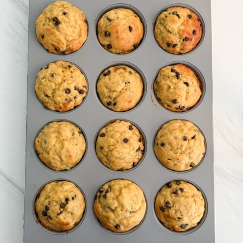 Banana bread freezer muffins with chocolate chips cooling on a wire rack